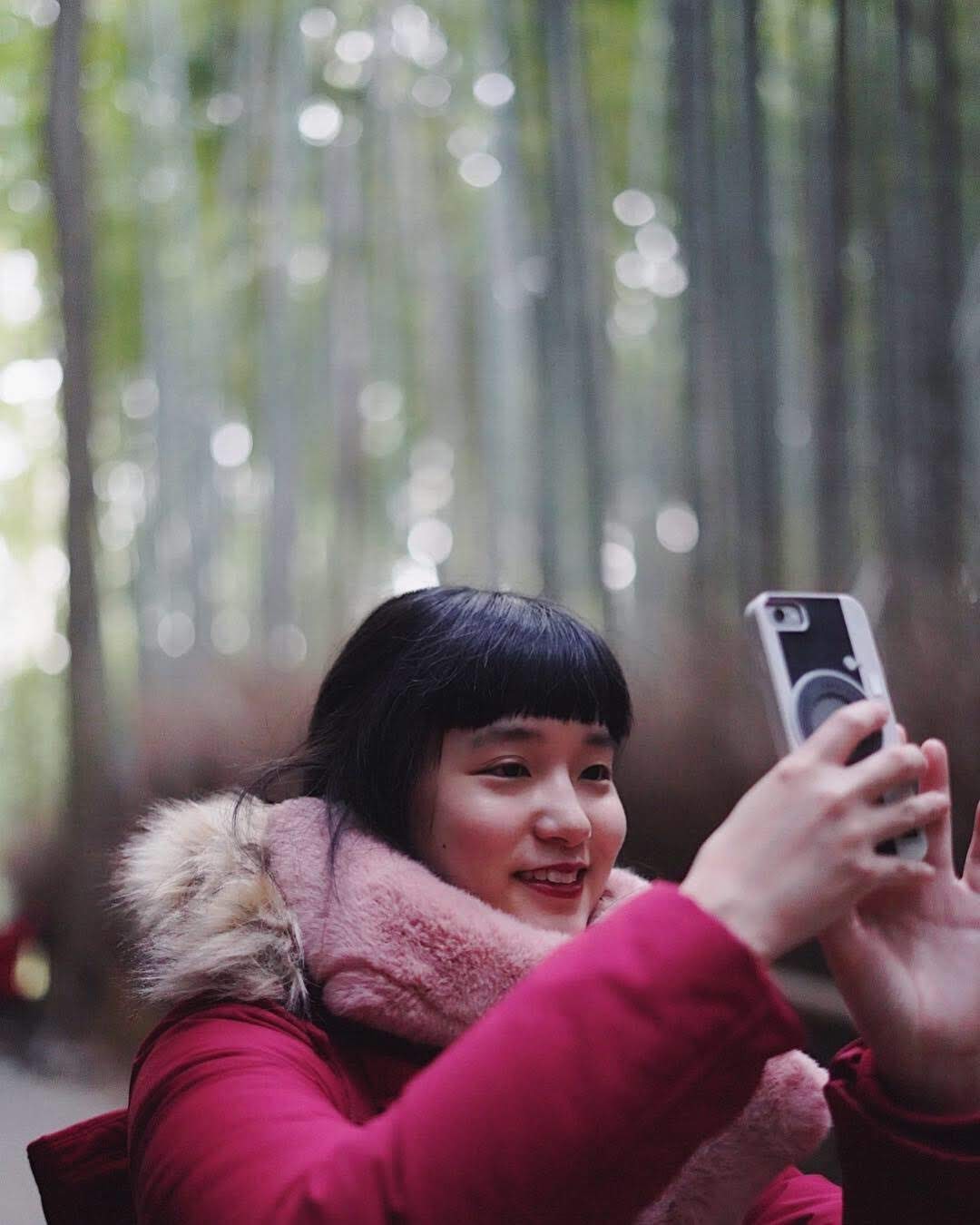 A photograph of my friend in the Arashiyama Bamboo Grove, at 50mm.